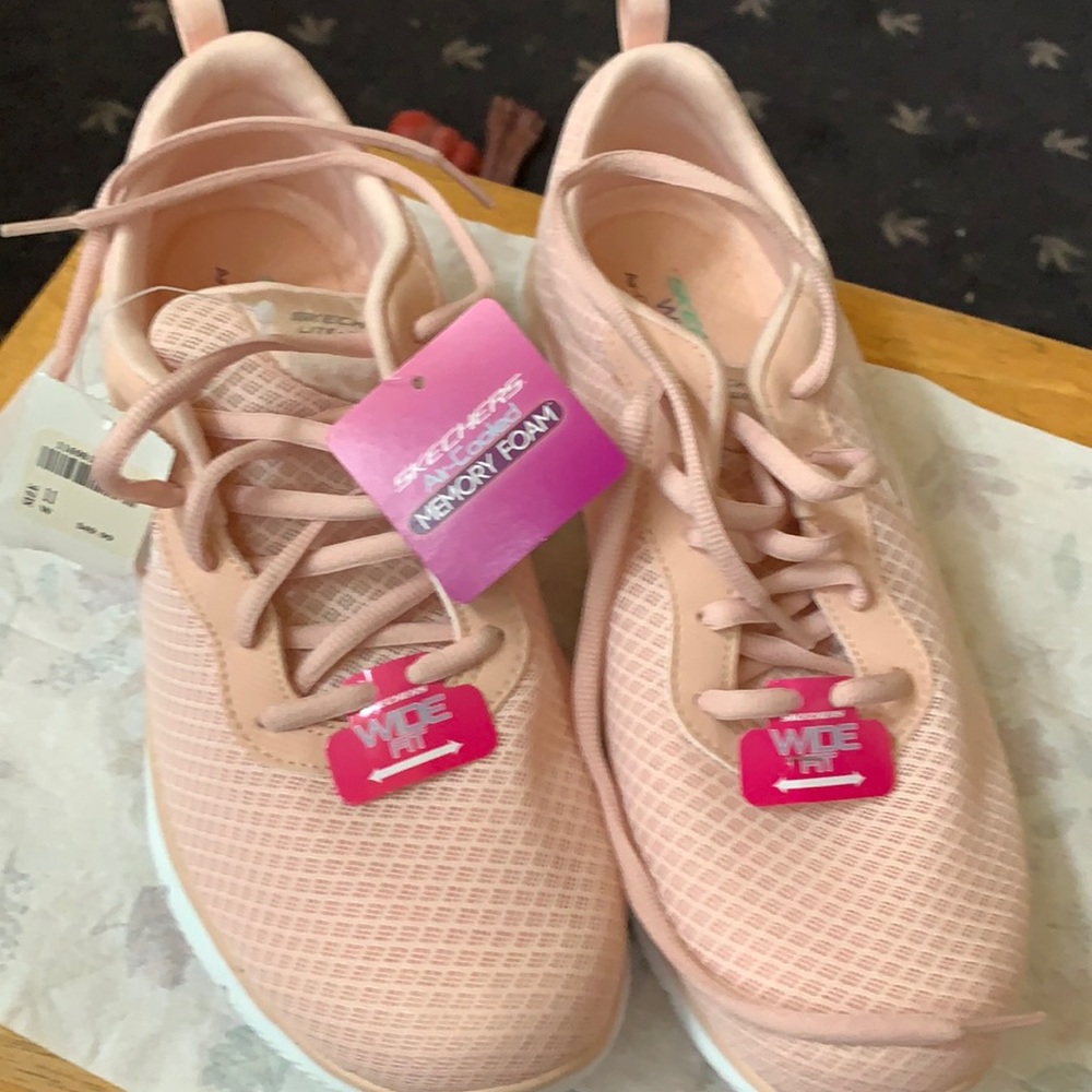 Blush colored. Never worn. 11 wide